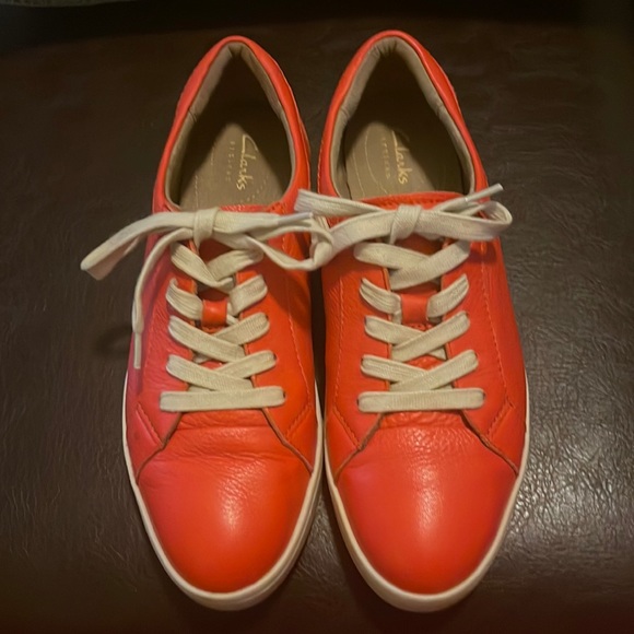 Clark’s Shoes - Clark’s women artisan sneaker in beautiful orange color. Pre owned great shape.
